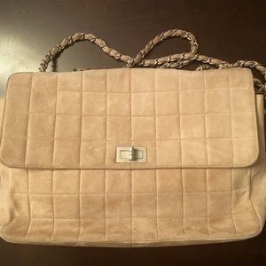 Vintage pink suede Chanel bad.  Photos show ware.  Suede needs to be cleaned,